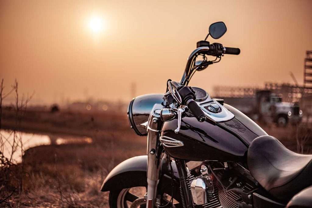 extroverted sensing Se motorcycle handle bars & a sunset in the backdrop